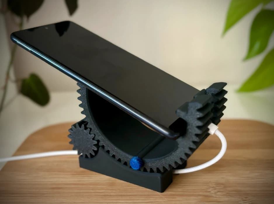 CogForm reclined with a phone connected to a charging cable